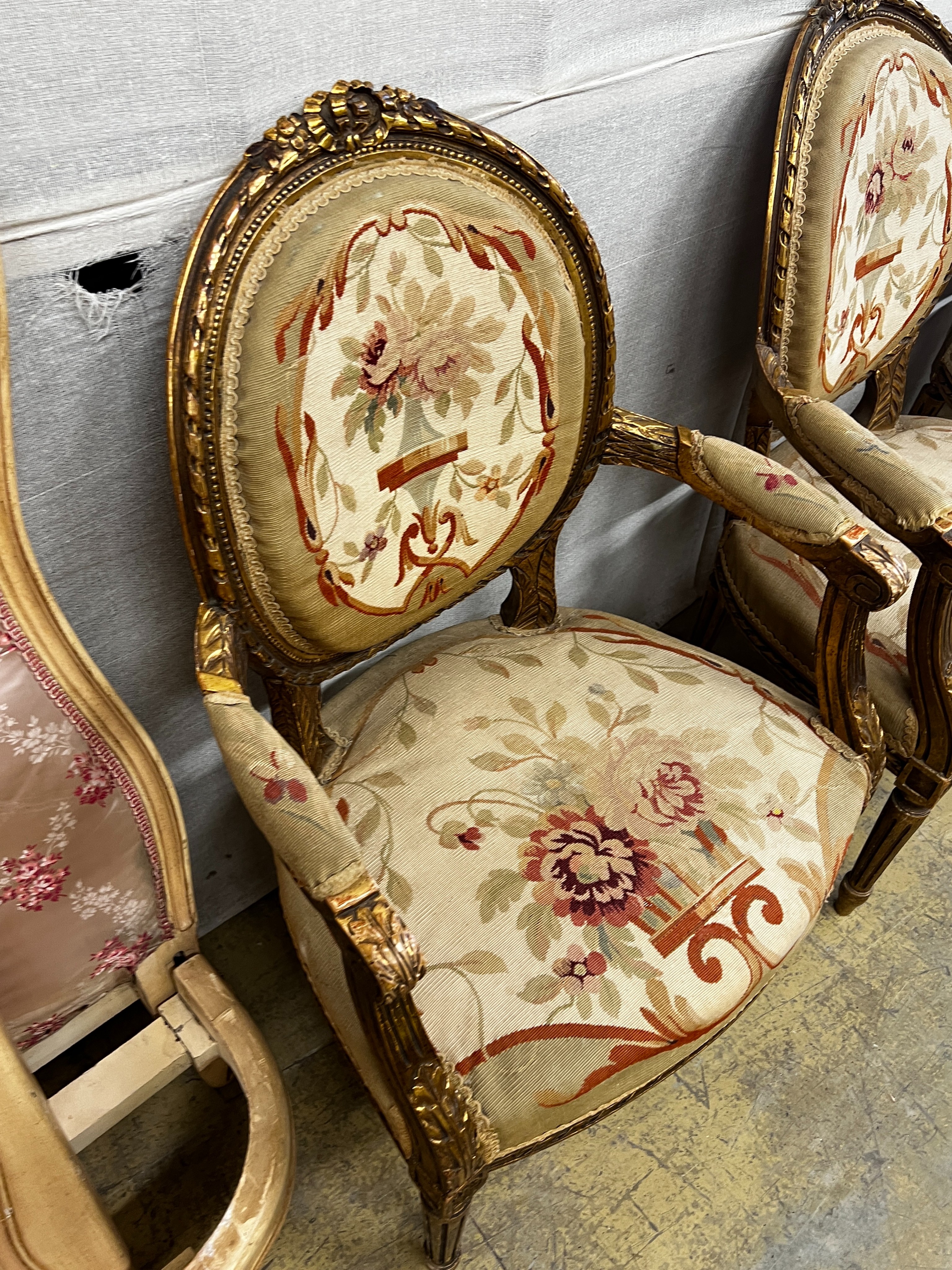 A Louis XVI style carved giltwood five piece salon suite, settee length 123cm, height 95cm